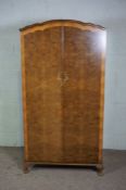 A walnut veneered wardrobe, with fitted interior, 174cm high, 72cm wide