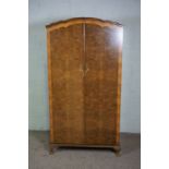 A walnut veneered wardrobe, with fitted interior, 174cm high, 72cm wide