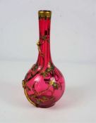 A Bohemian cranberry glass vase, 19th century, of globular form, with a long neck, entwined by