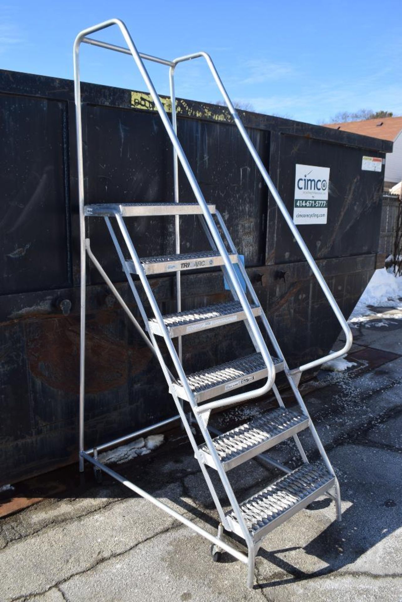 Lot of (2) Tri-Arc aluminum ladders. (1) Rolling approximate 6' tall, (1) stationary approximate 5'