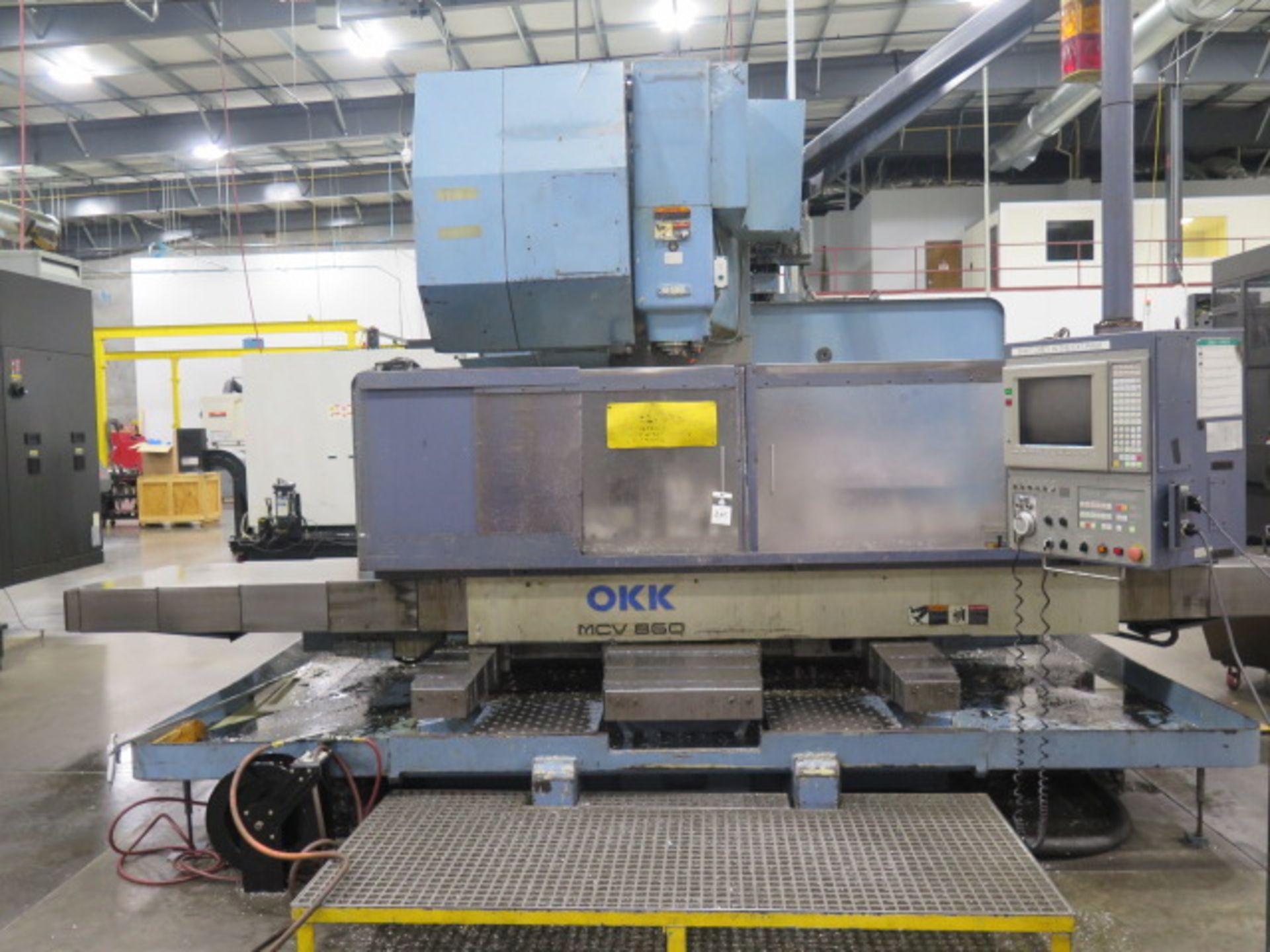 OKK MCV860 CNC VMC s/n 106 w/ OKK Neomatic Controls, 30-Station Side Mount ATC, SOLD AS IS