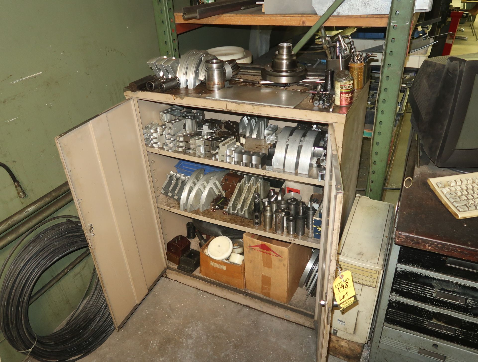 METAL STORAGE RACK W/ CONTENTS, CNC LATHE TOOLING, PIE JAWS, ETC.