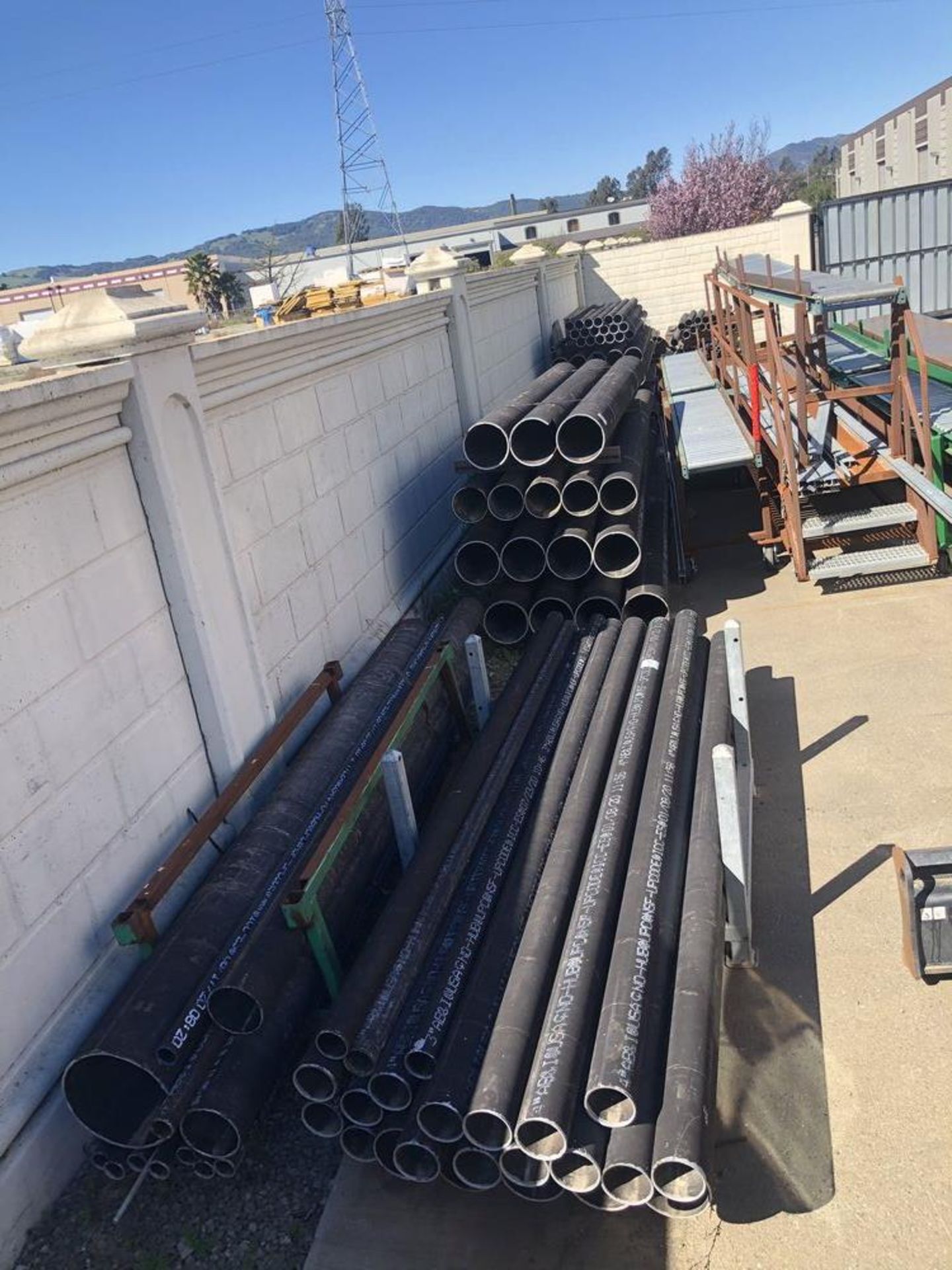 (LOT) LARGE LOT OF MISC CAST IRON PIPE WITH RACKS