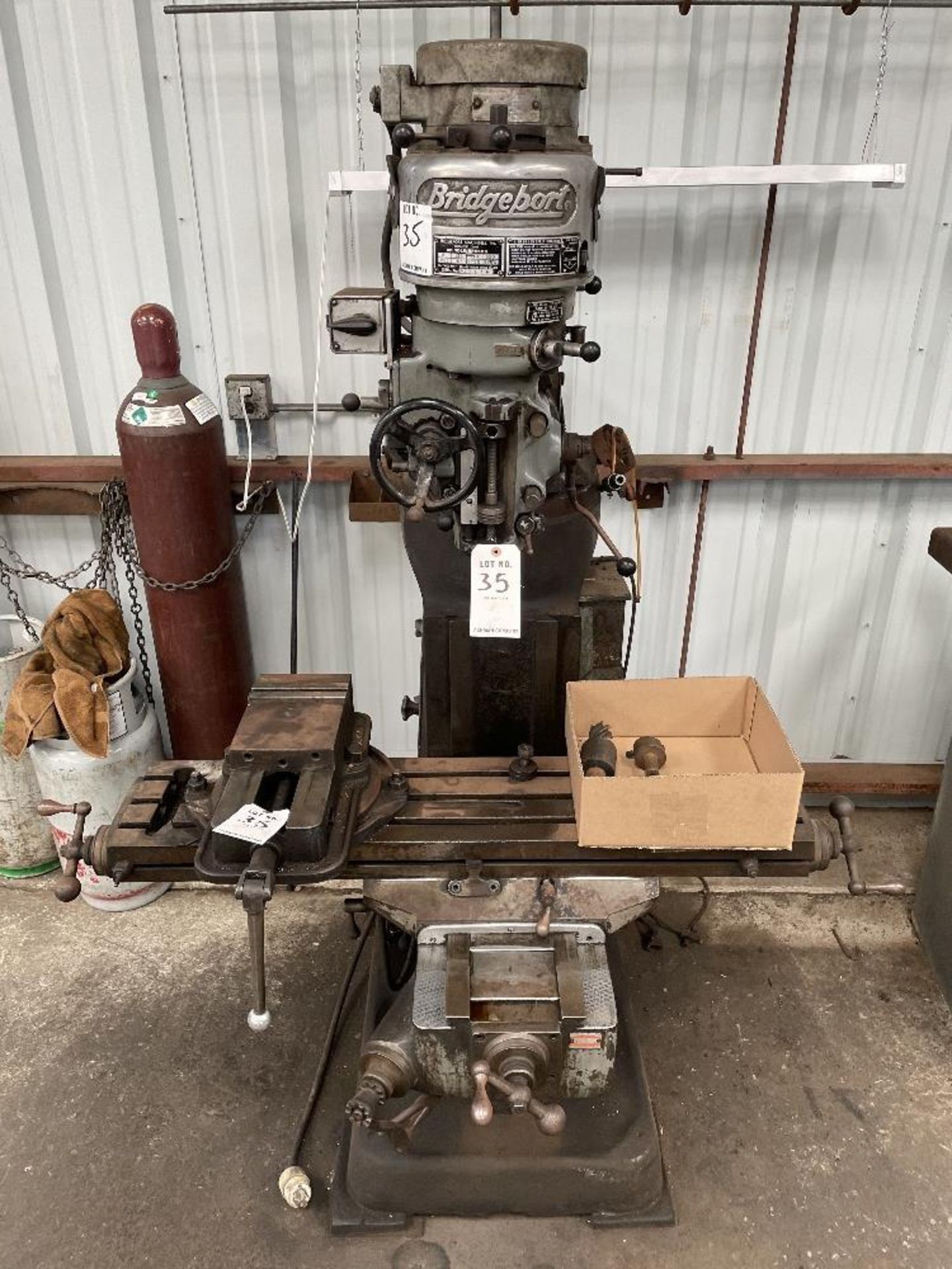 (1) Bridgeport Mill- 1 hp, 48” t slot table, 80-2720 rpm, with 6” vise and r-8 collets s/n- 122580