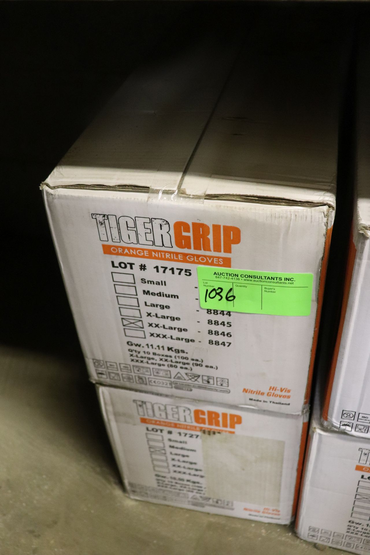 Two boxes of Tiger Grip Orange Nitrile gloves