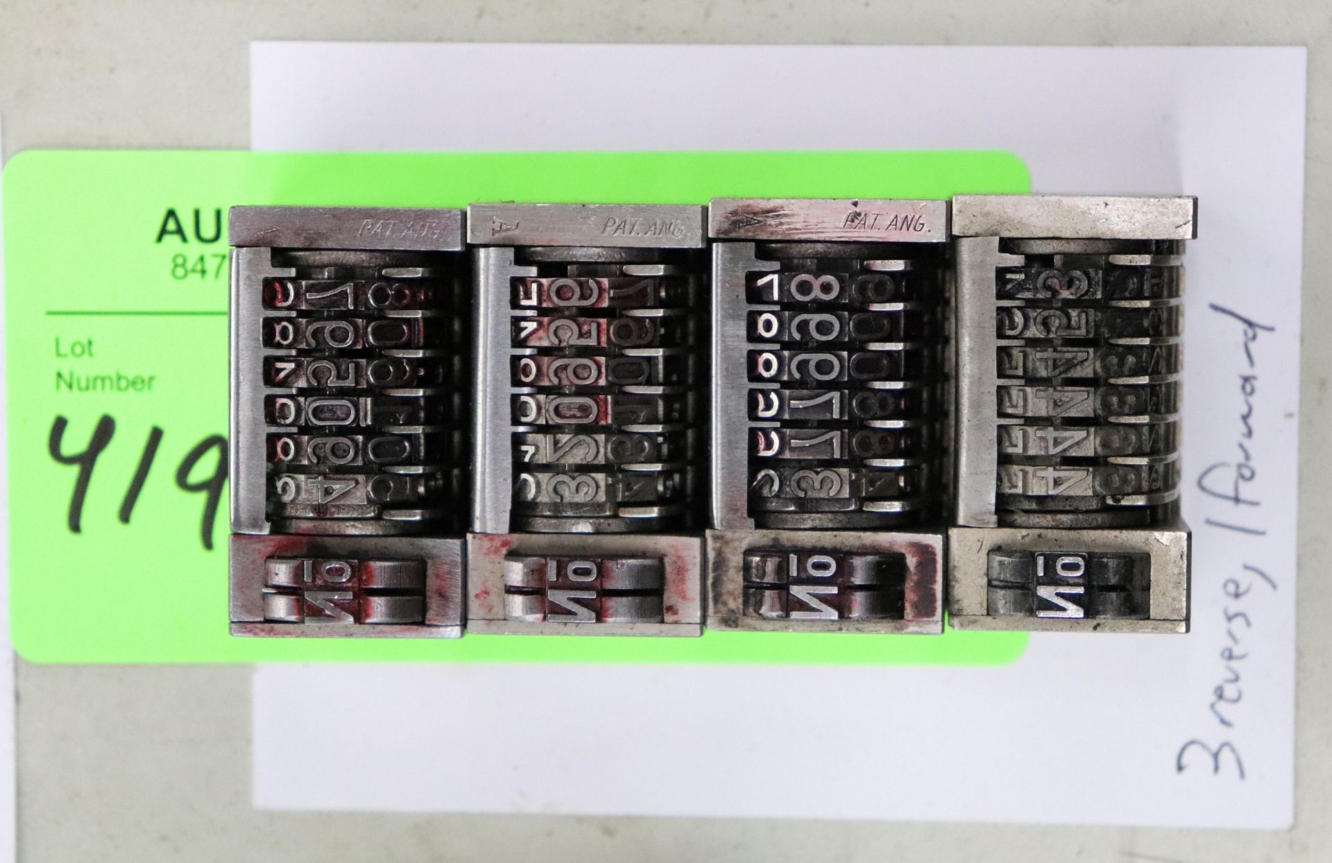 Set of three reverse and one forward numbering machines