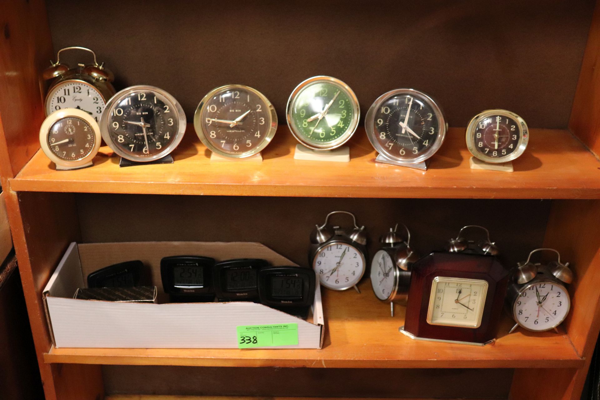 Group of alarm clocks: Big Ben, Equity and Sharp, and Westclox atomic clocks