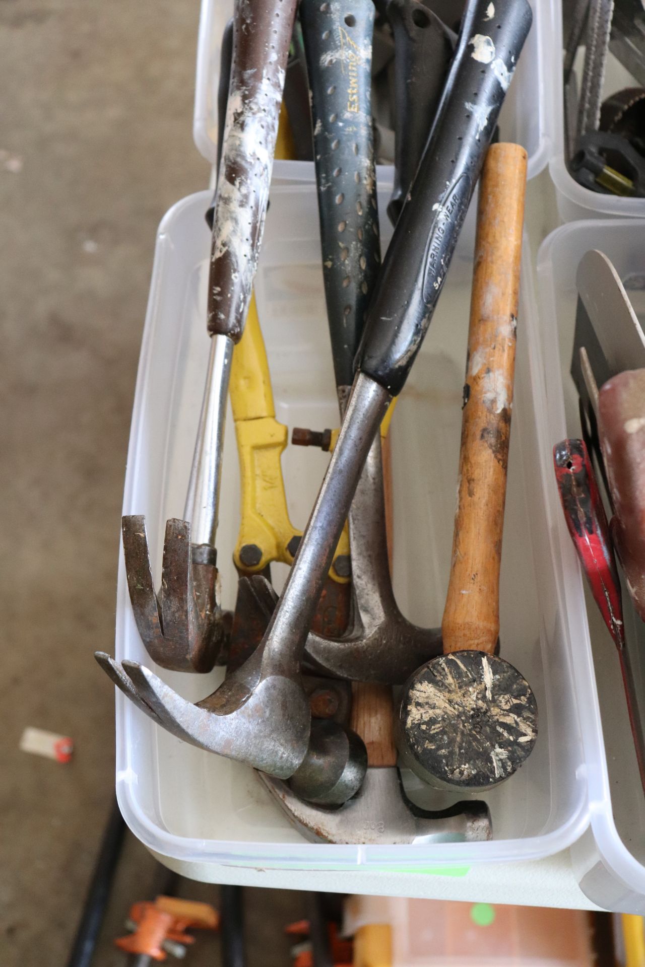 Group of hammers, cable cutters, and mallet