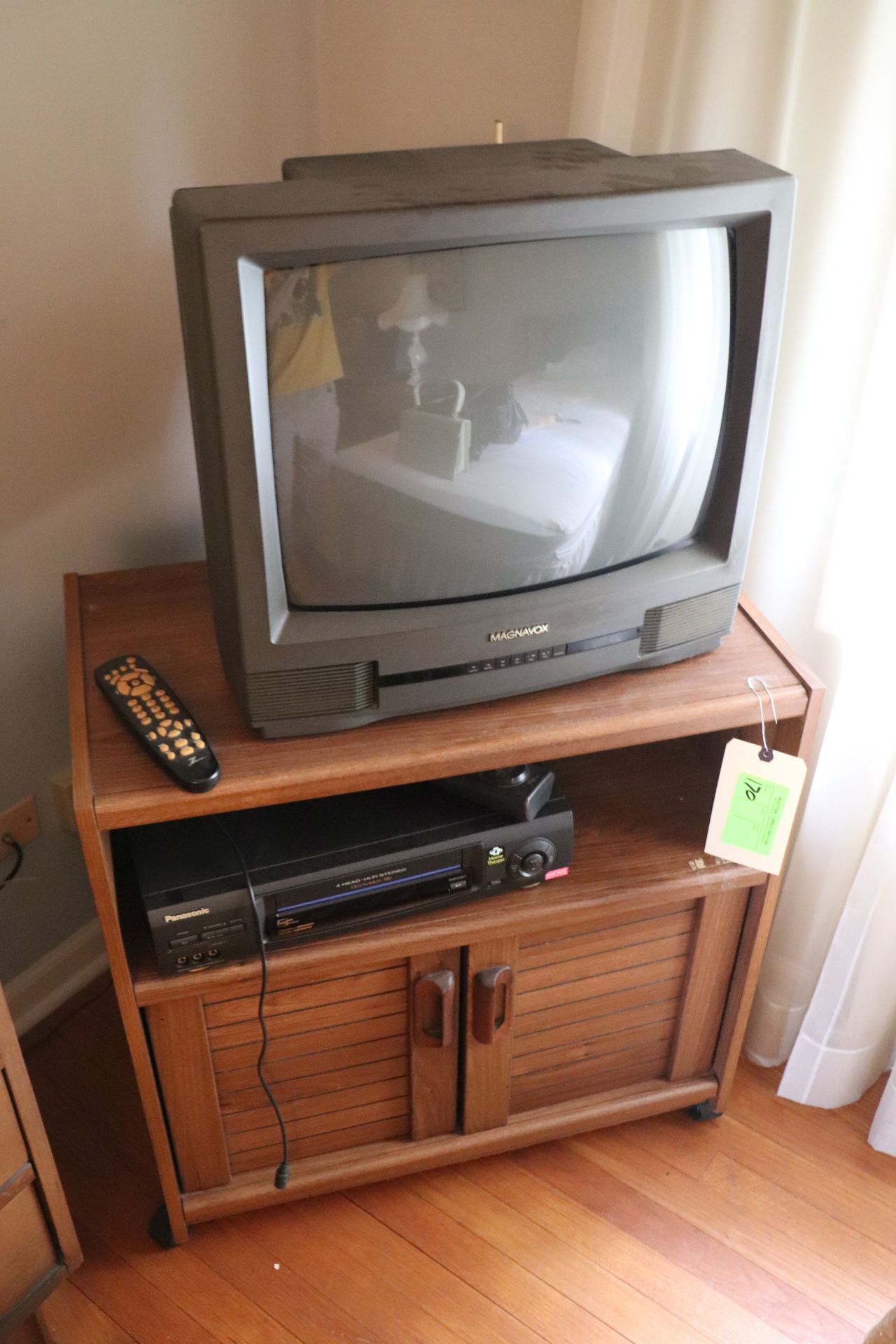 Group: Magnavox television, 20", Panasonic Omnivision VCR, and TV stand