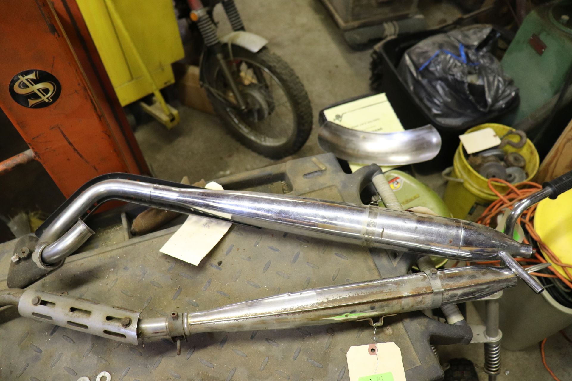 Pair of Benelli, Sachs, Coleman and Arctic Cat exhaust pipes