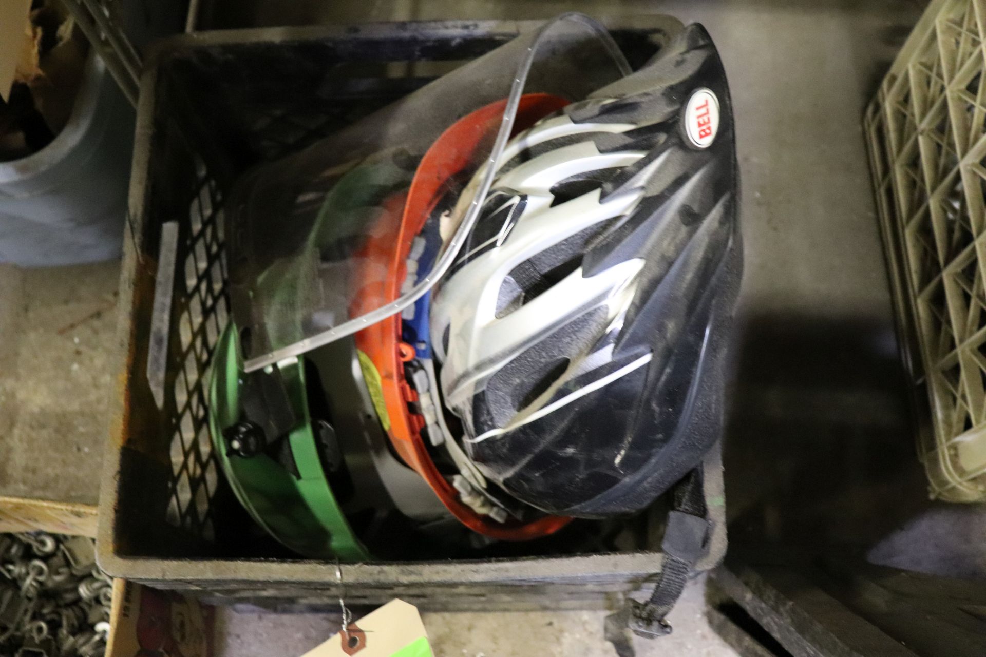 Group: bike helmet, two hard hats, one with face shield