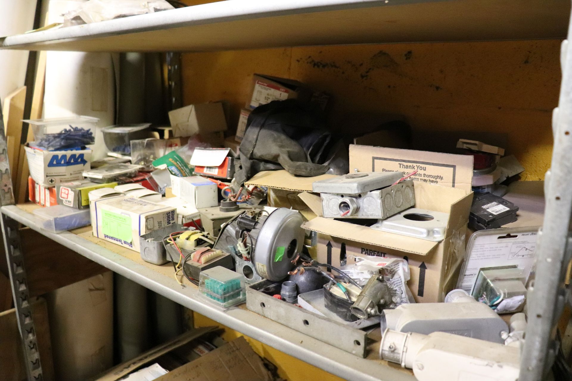 Everything on shelf: fittings, screws, staples, couplings, tool belt, electrical box