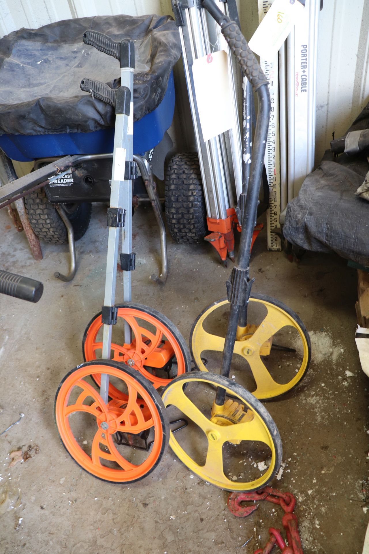 Four measuring wheels, two Kenson model RR31AN and two Stanley