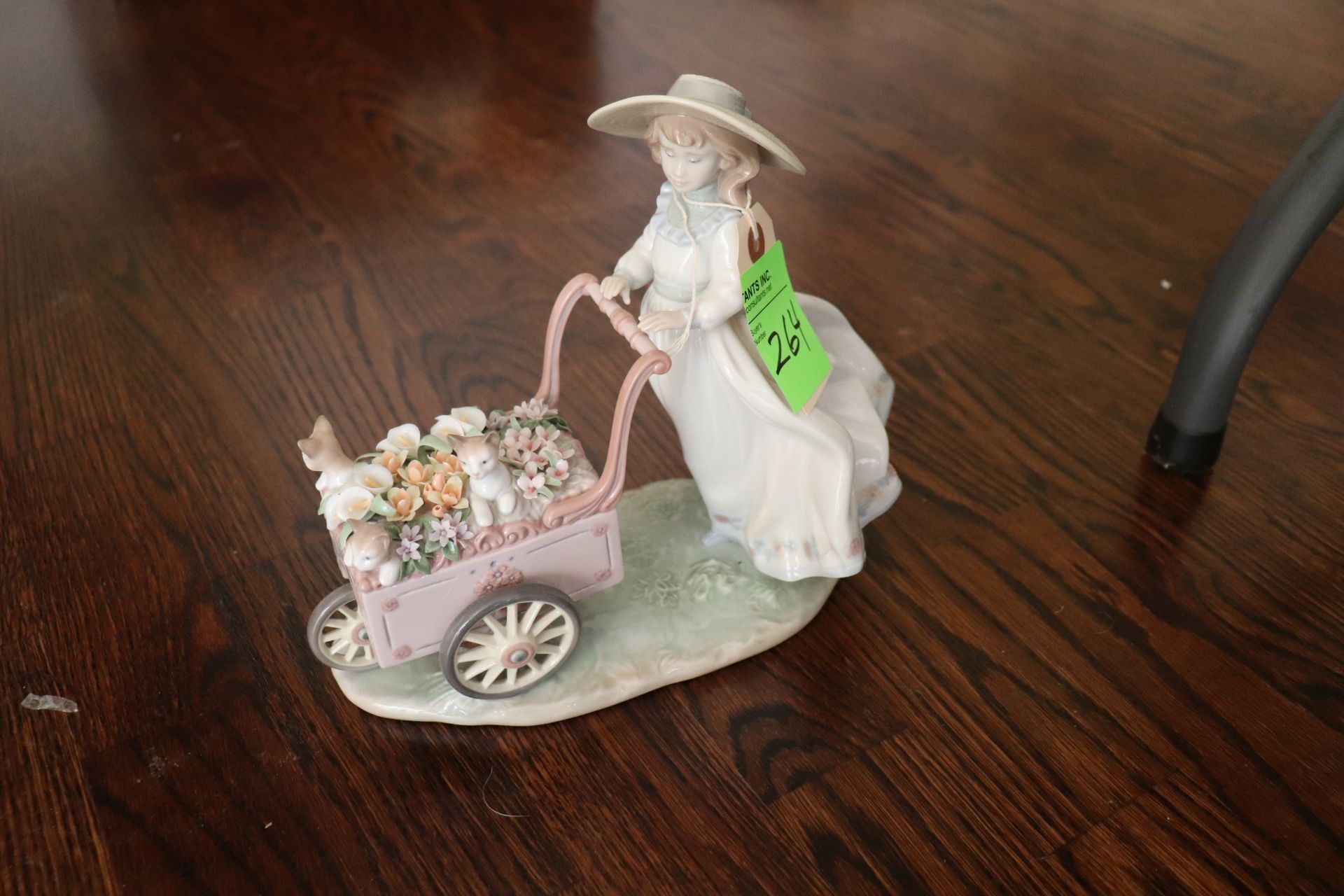 Lladro figure #6141 depicting woman pushing flower cart with cats, approximate height 7-1/2"