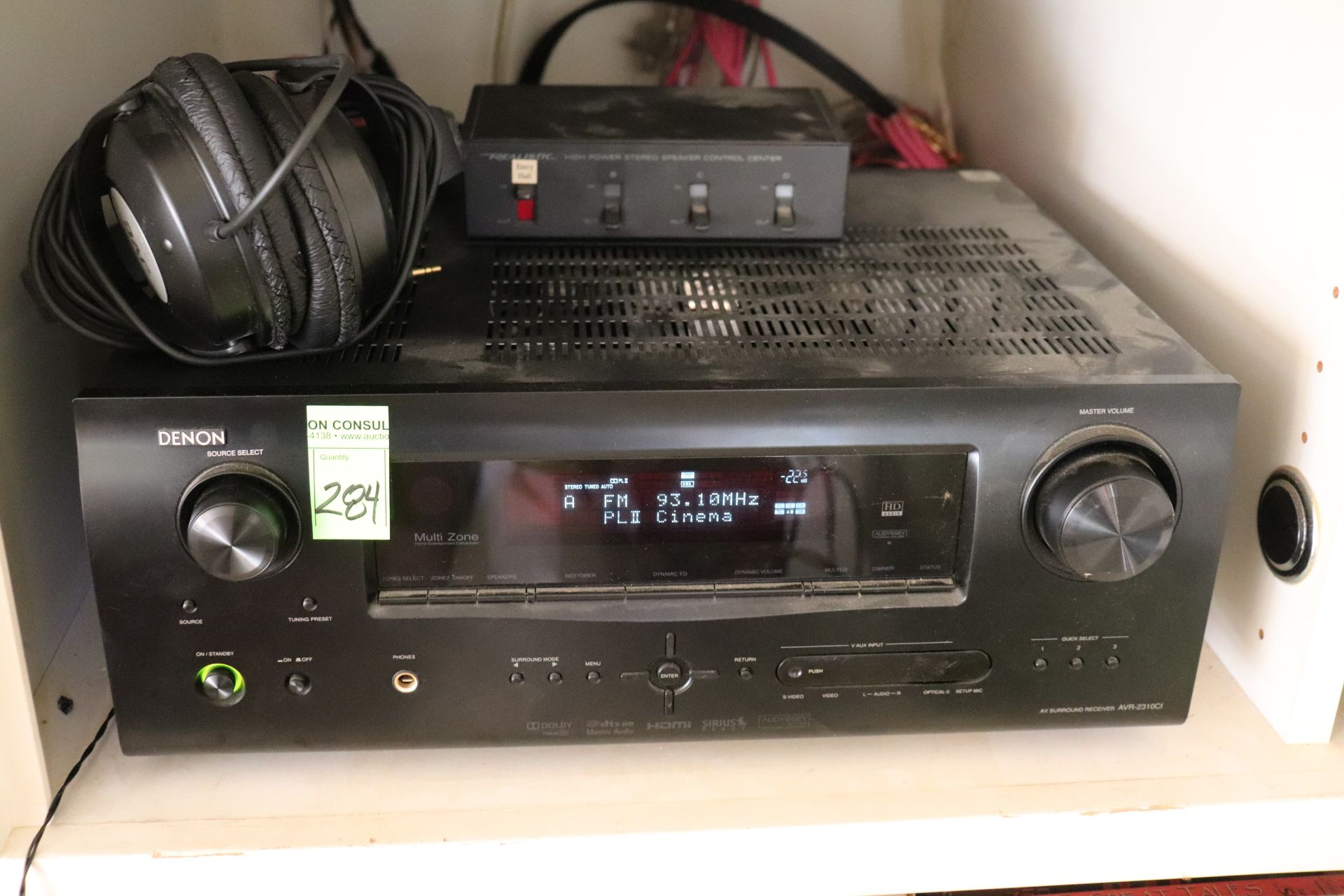 Denon stereo receiver tuner, model AVR-2310C1, with JVC digital headphones, model HA-D50, and Realis