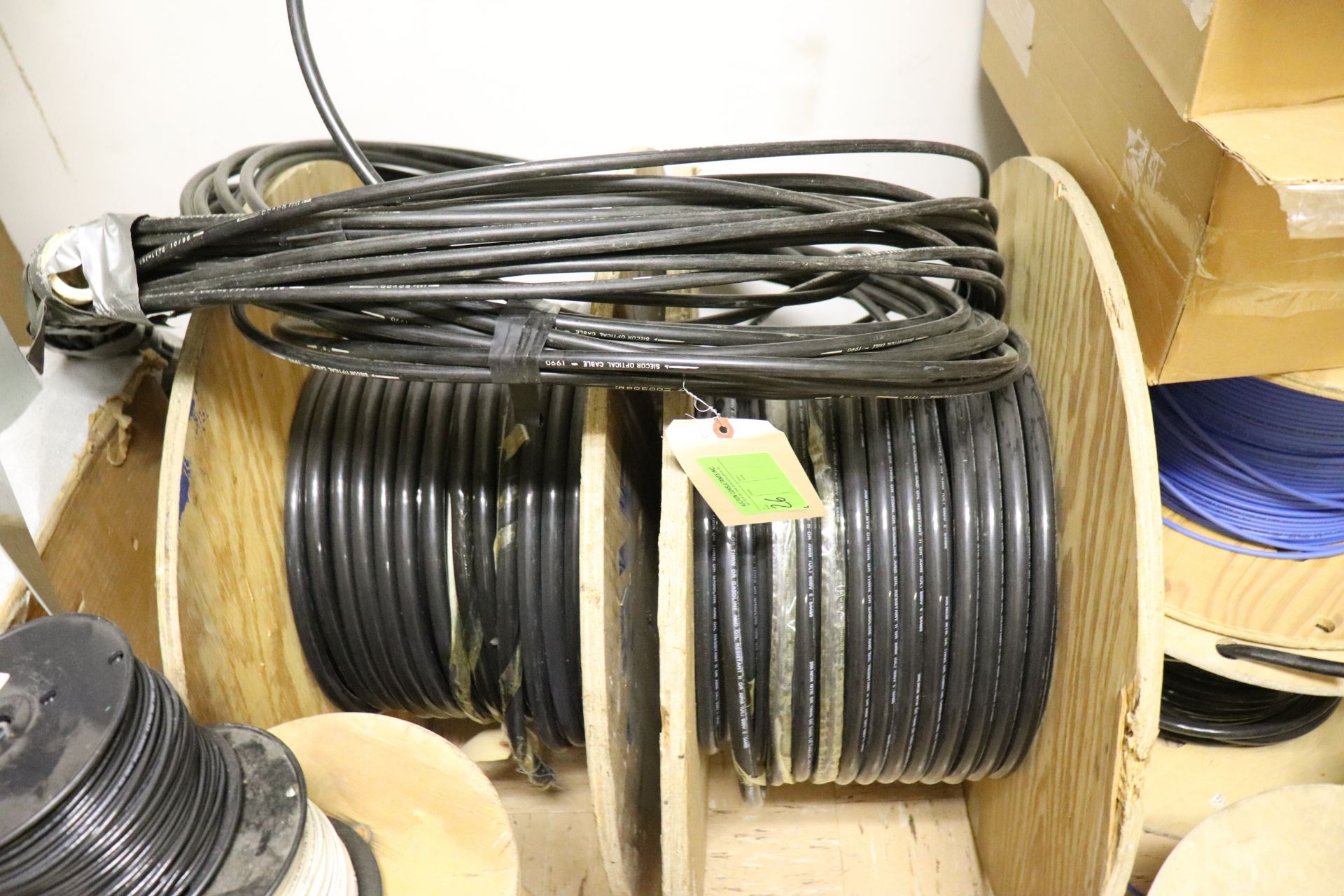 Two spools of copper wire and roll on top of them