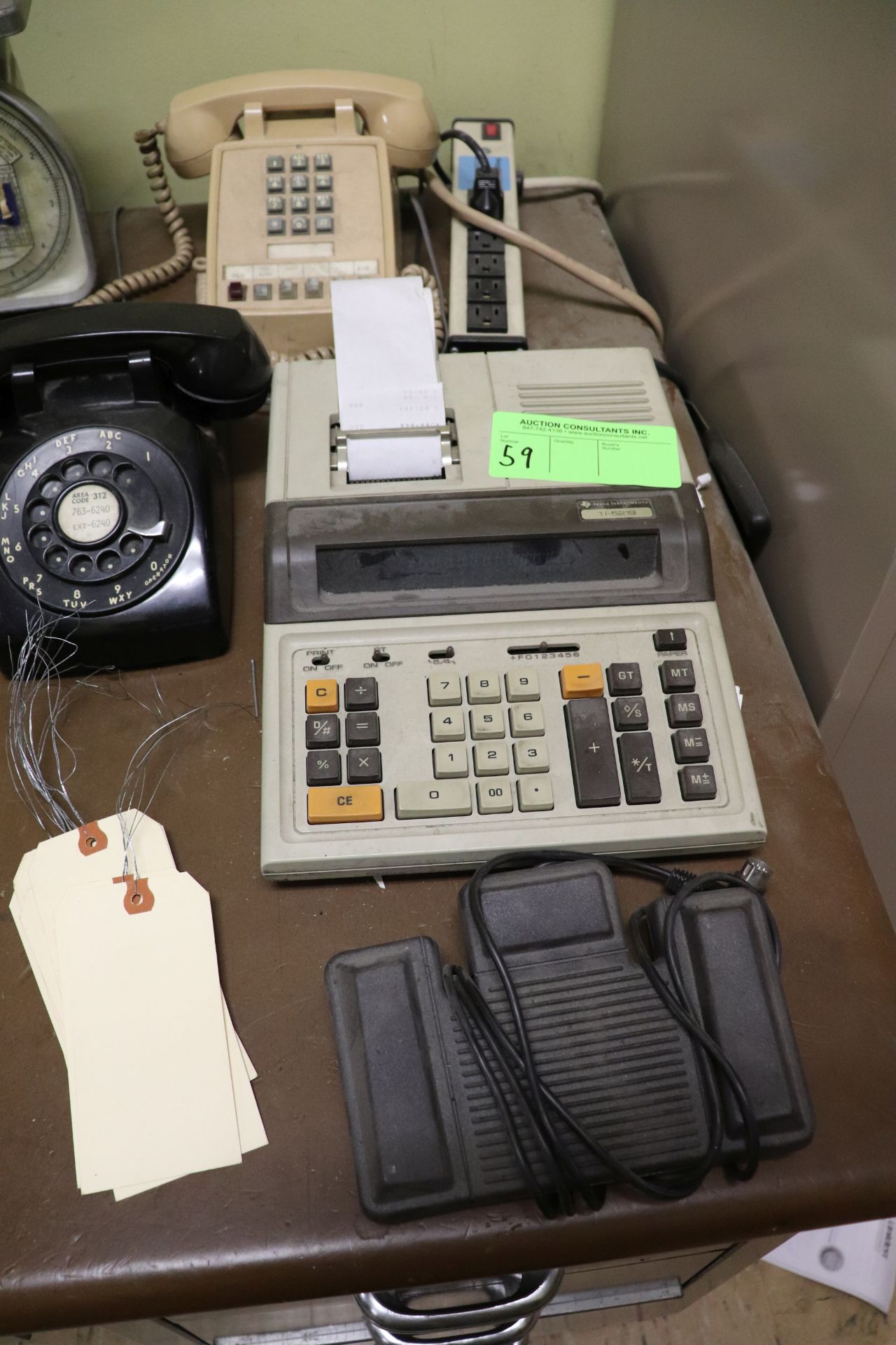 Group consisting of a calculator by Texas Instruments, model TI-5219, and two telephones, vintage