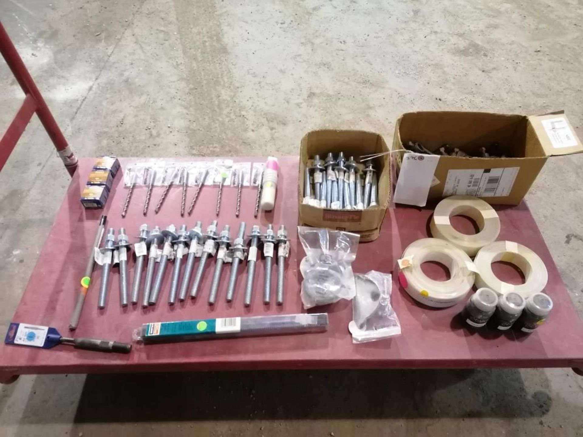 (1) Box of Miscellaneous Anchor Bolts, Rolls of Facing Materials & Drill Bits. Located in Lincoln,