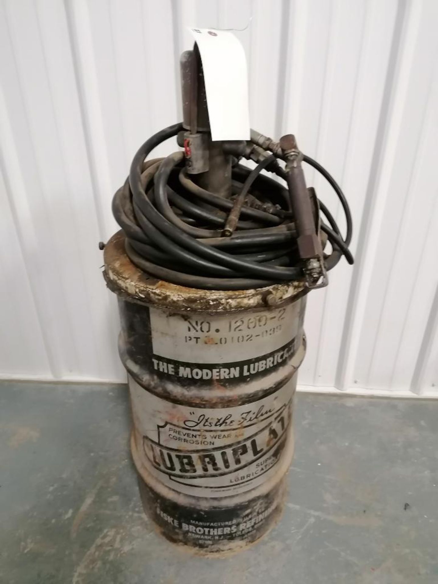 (1) Grease Barrel with Pump. Located in Mt. Pleasant, IA.