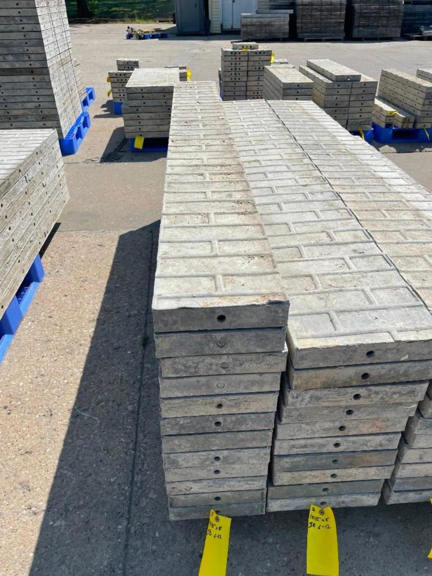 (12) 10" x 8' Symons Smooth Brick Aluminum Concrete Forms 6-12 Hole Pattern. Located in Mt. Pleasant