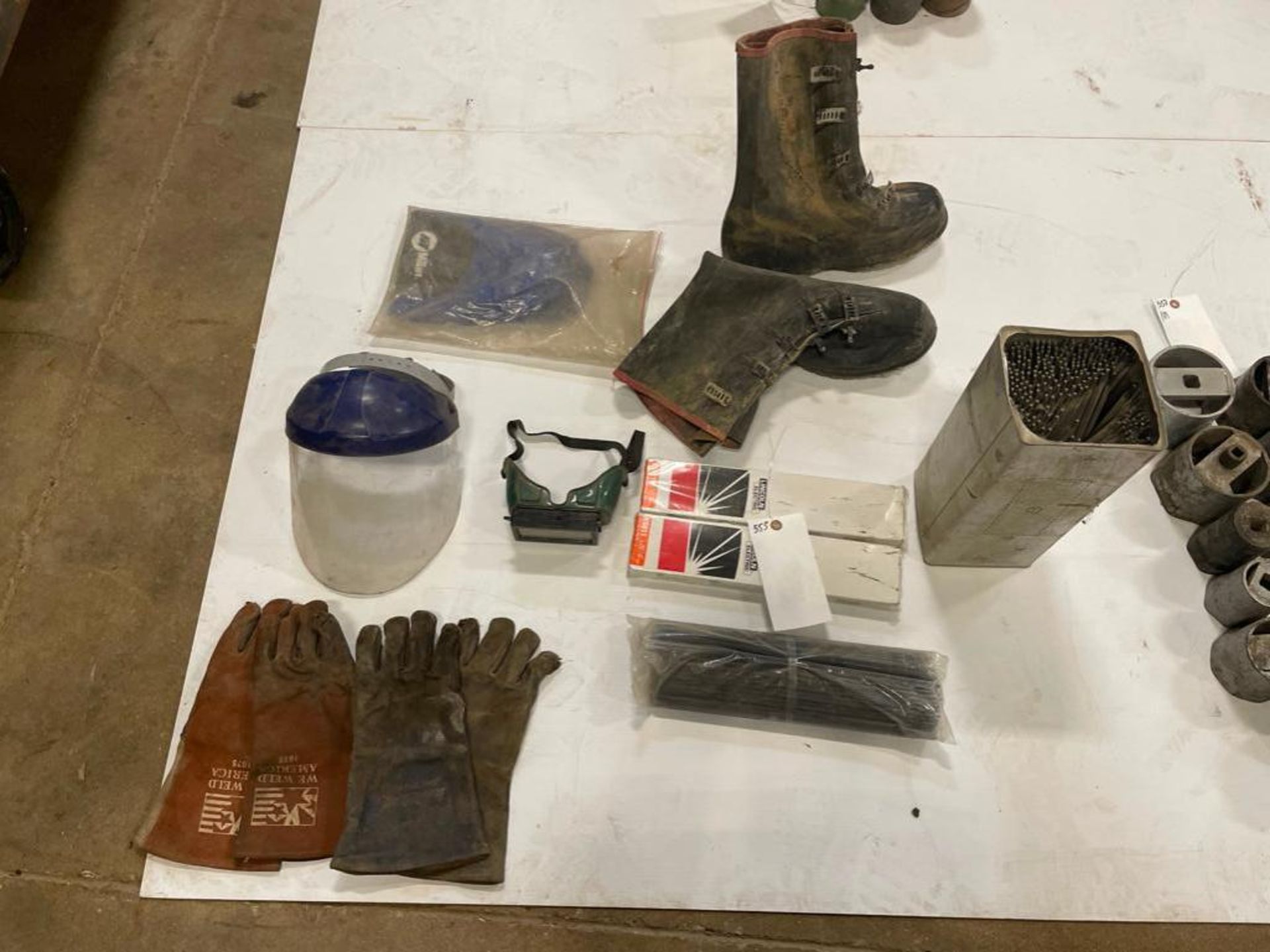 Miscellaneous Shop Supplies. Boots, Gloves, Face Shield, Welding Rod, Eye Goggles. Located in Hazelw