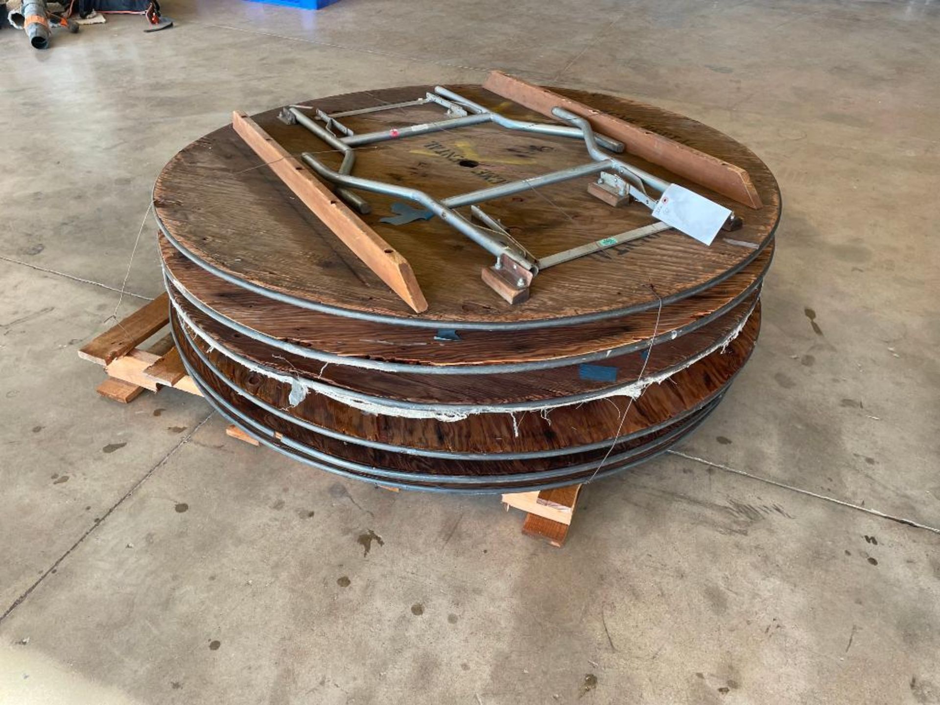 Pallet with 6 Round Tables. Located in Hazelwood, MO.