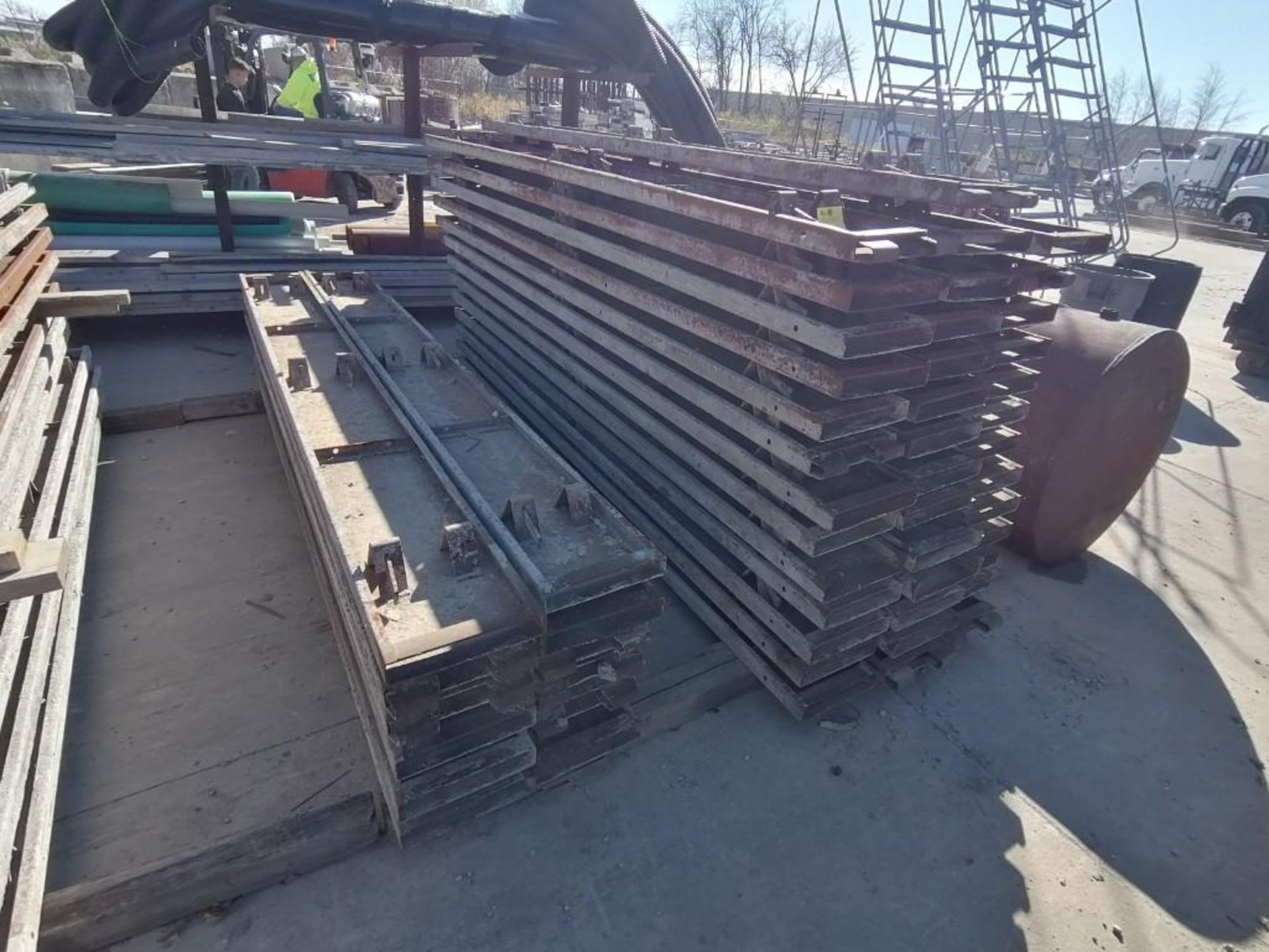(52) 12" x 2" x 10' Steel Paving Forms. Located in Hazelwood, MO.