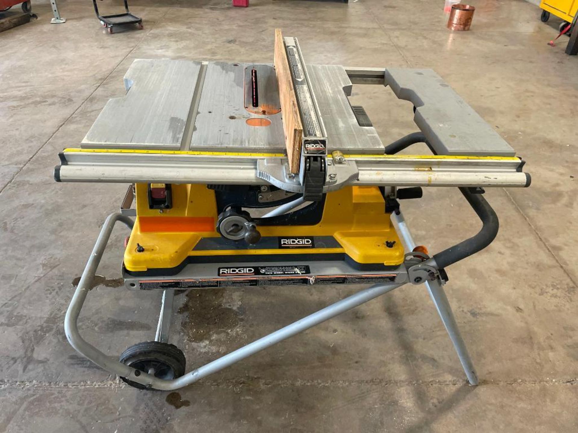 Rigid 10" Tilt Table Saw on Rigid Work-N-Haul-It Two Wheel Work Stand. Located in Hazelwood, MO