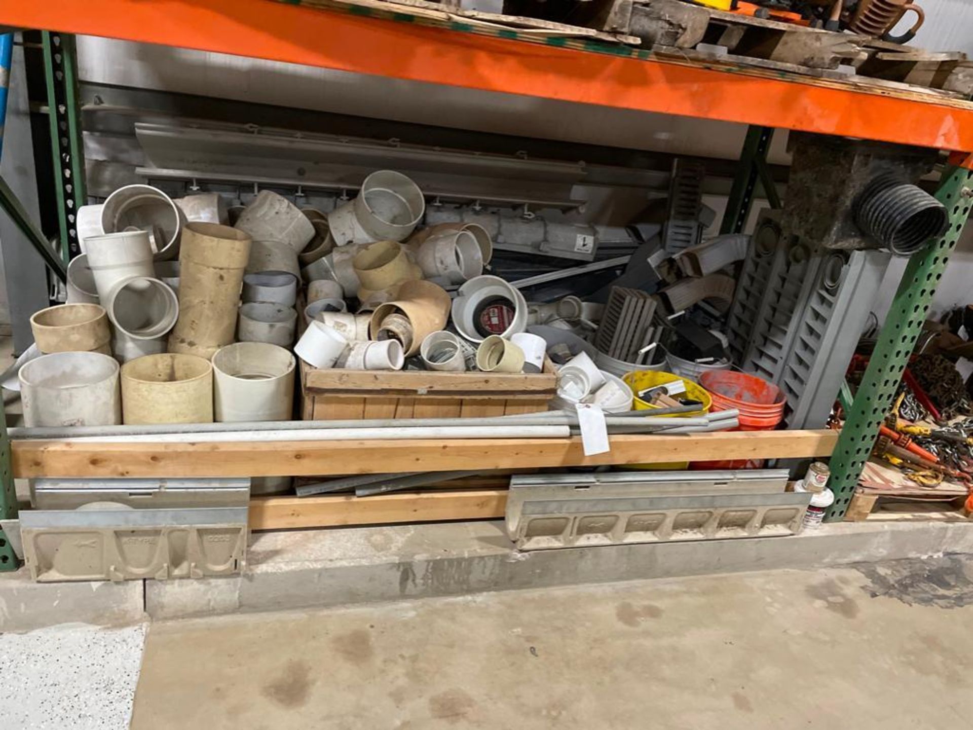 Miscellaneous Contents of Shelf, Elbows, PVC Pipe, Wire Conduit, Clamps, Gutter Elbows, Etc. Located