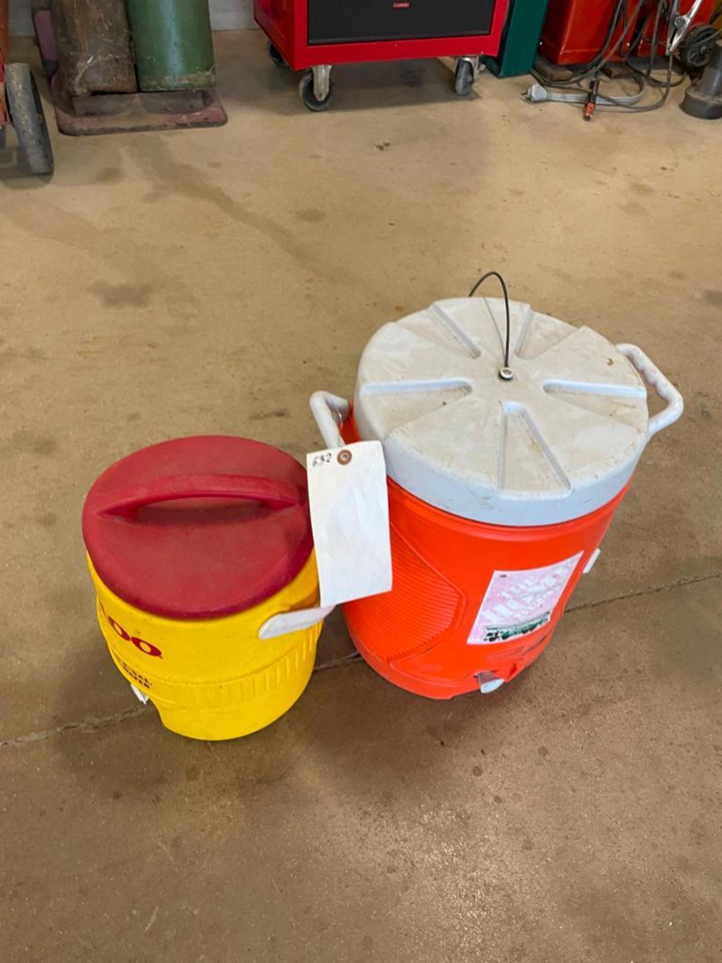 Lot of (2) Water Coolers, Igloo & Home Depot. Located in Hazelwood, MO