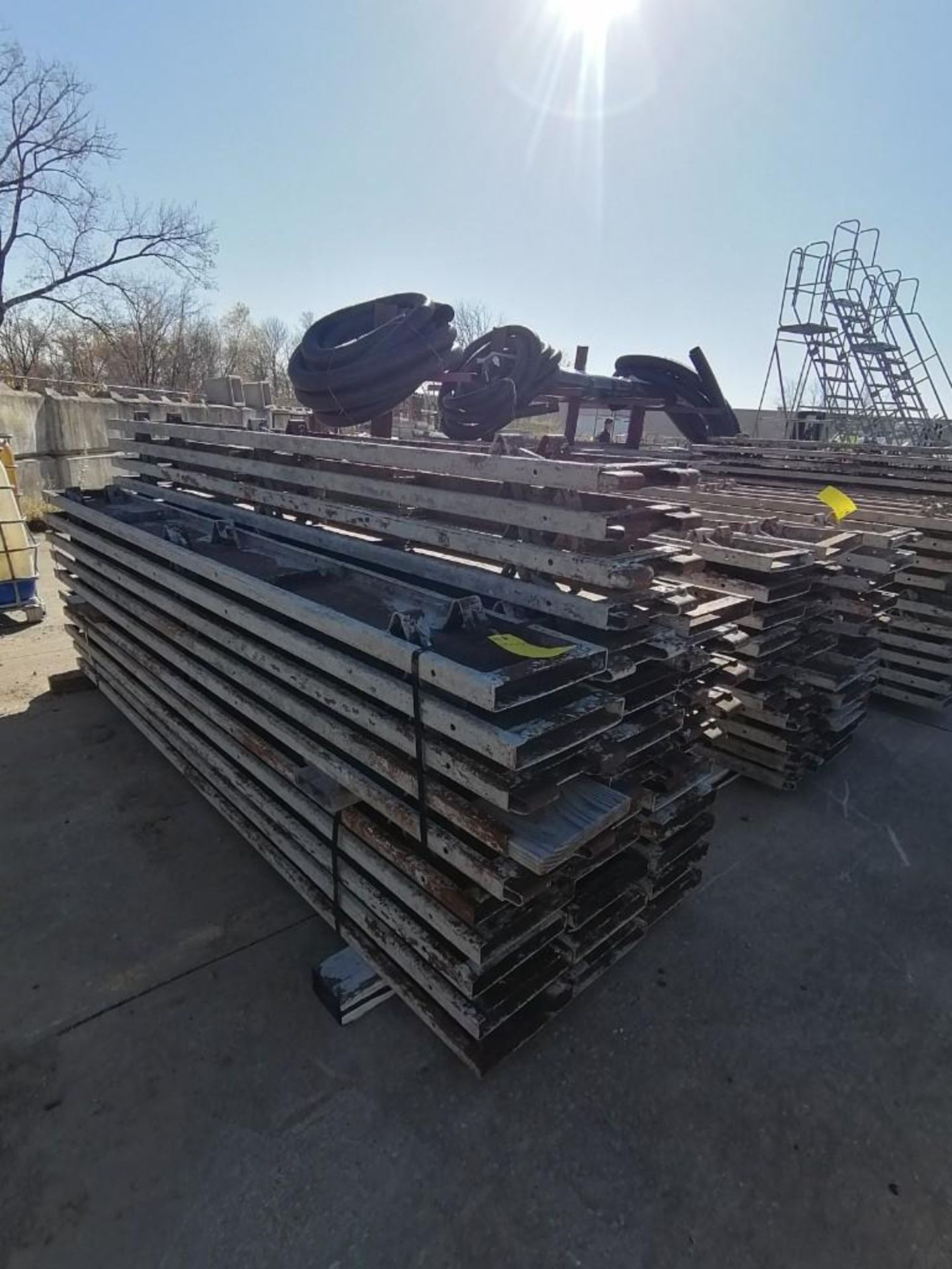 (34) 12" x 2" x 10' Steel Paving Forms. Located in Hazelwood, MO.