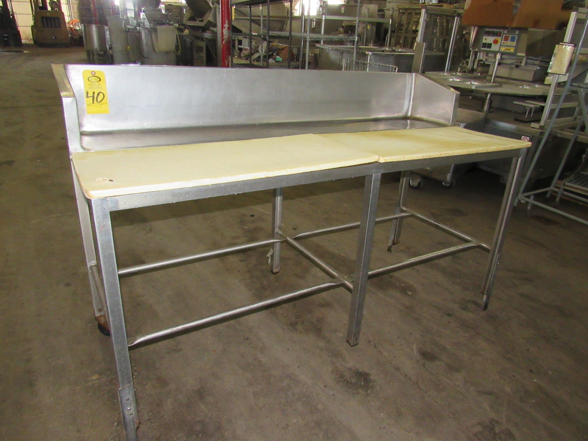 Stainless Steel Table, 28" W X 6' L, 10" stainless steel backsplash, poly tops