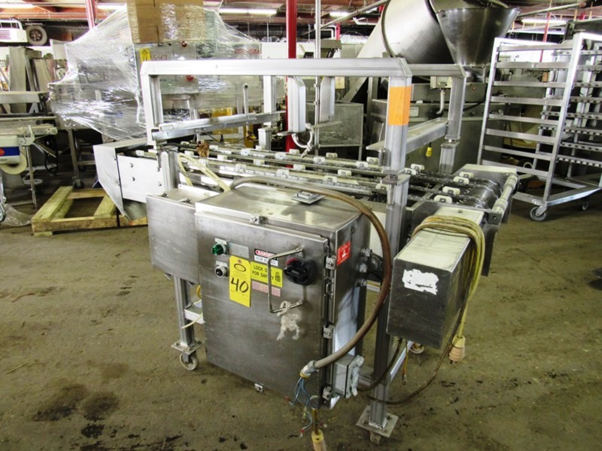 Stainless steel dual lane conveyor last used for 10” round frozen pizza transfer. 4’ wide x 6’