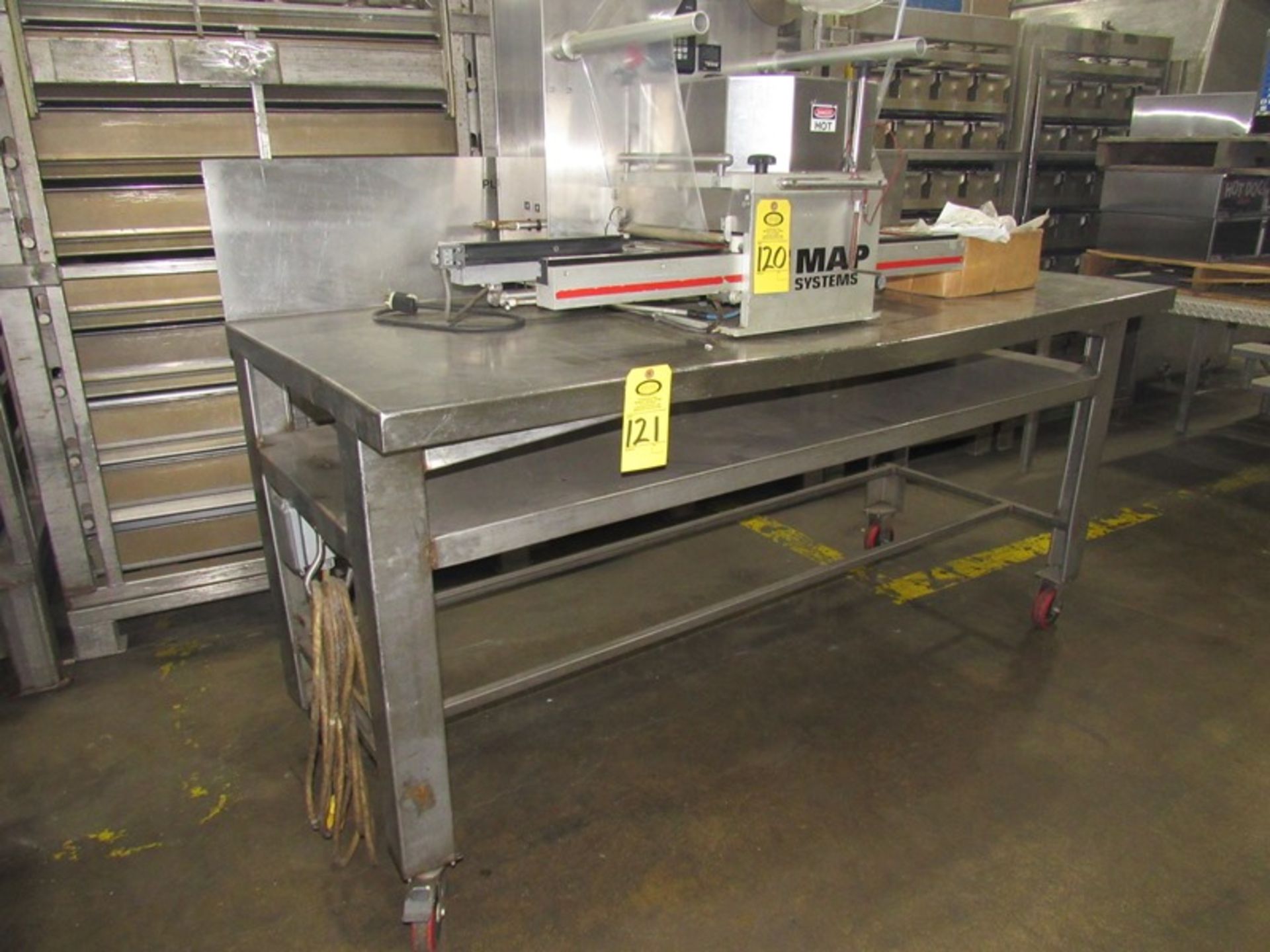 Portable Stainless Steel Table, 34" W X 77" L X 39" tall, 12" backsplash, 110 volt power hook up,