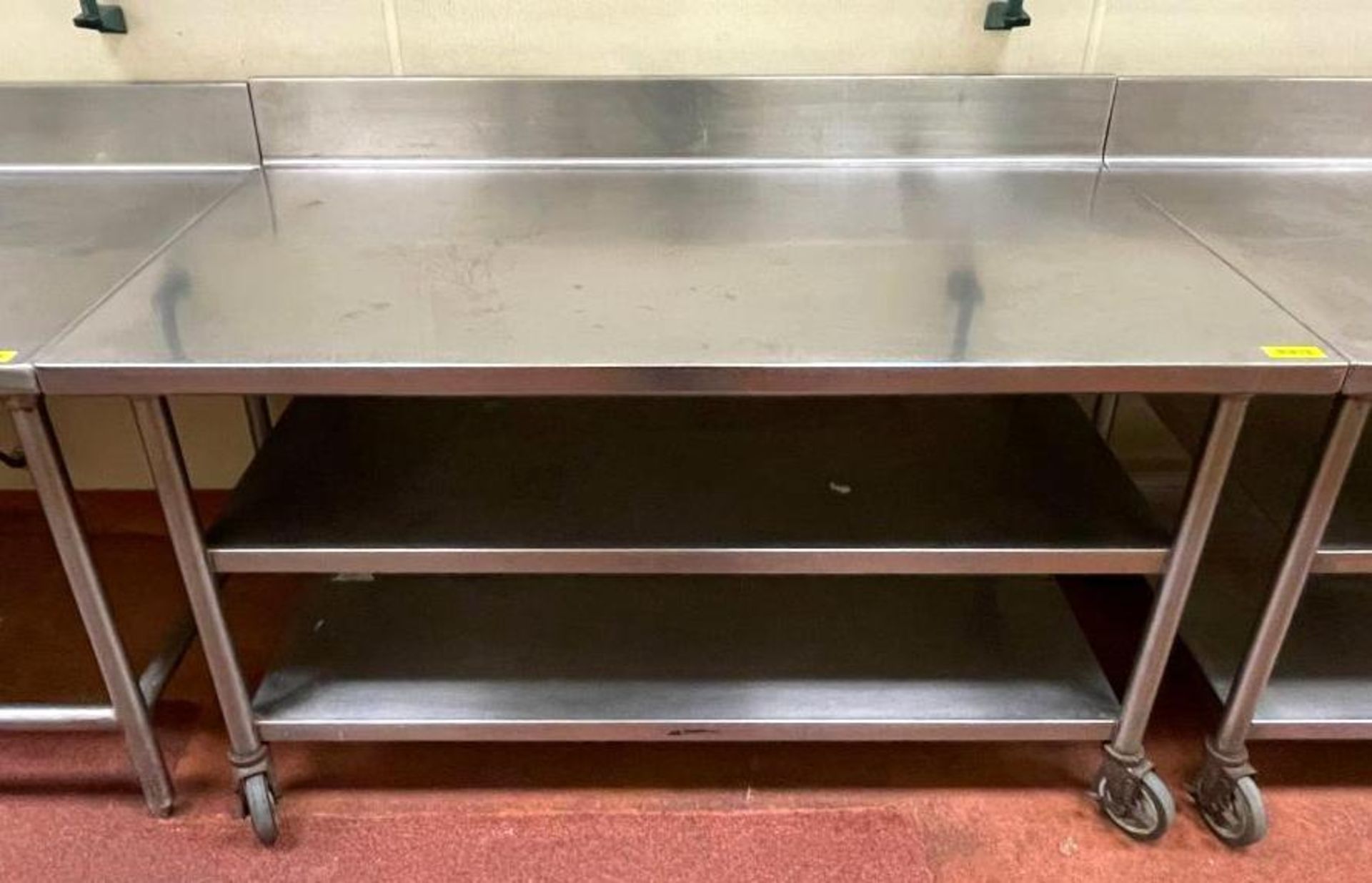 DESCRIPTION 5' STAINLESS TABLE WITH BACKSPLASH AND UNDERSTORAGE ON CASTERS SIZE 60"X30" QUANTITY: X