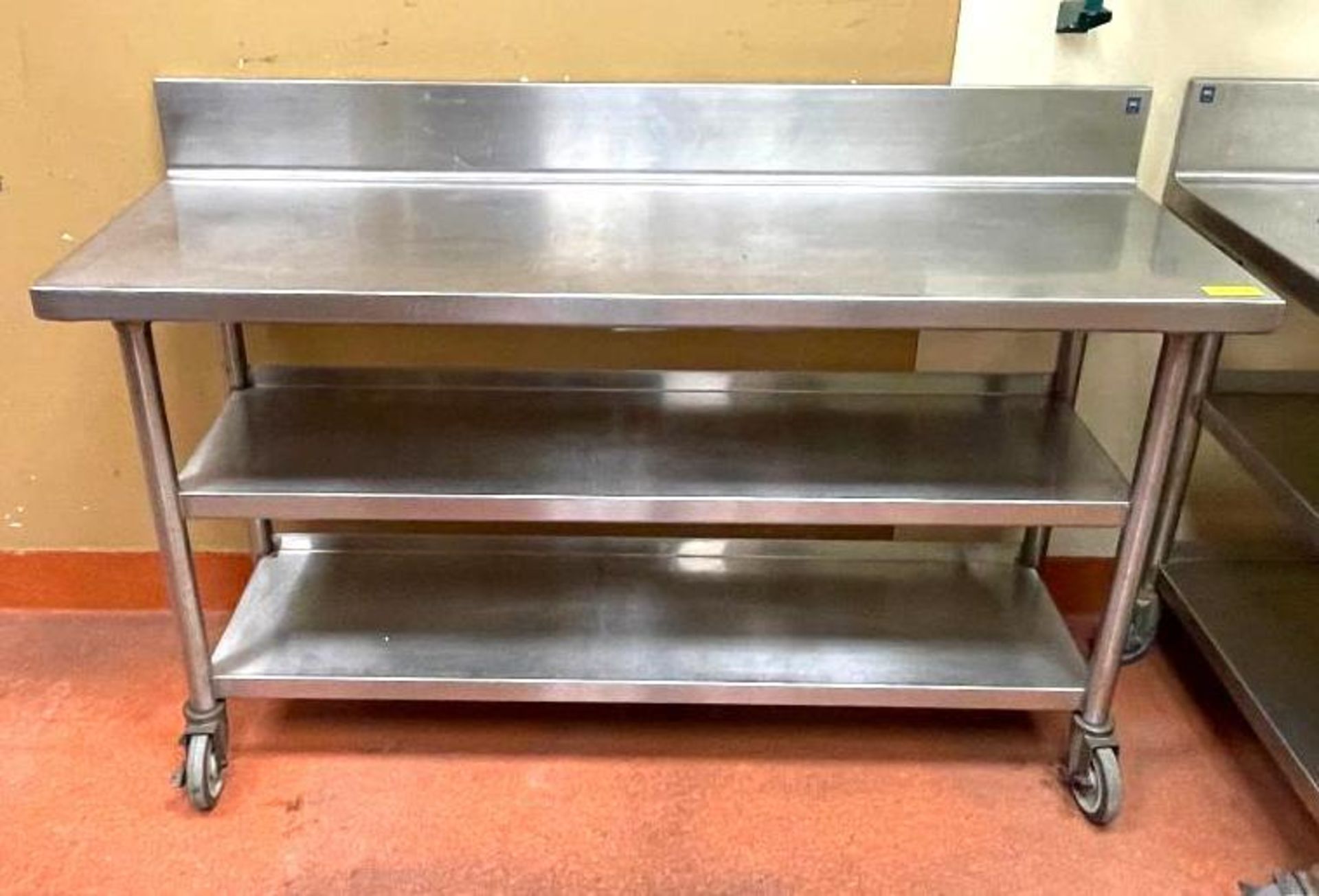 DESCRIPTION 5' STAINLESS TABLE WITH BACKSPLASH AND UNDERSTORAGE ON CASTERS SIZE 60"X18" QUANTITY: X