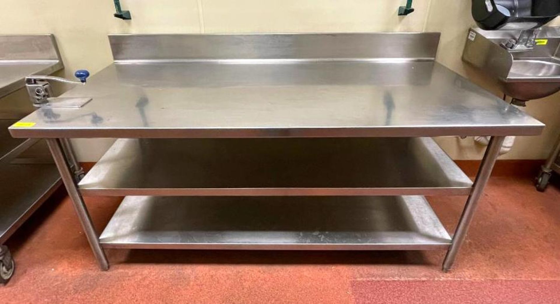 DESCRIPTION 6' STAINLESS TABLE WITH BACKSPLASH AND UNDERSTORAGE ON CASTERS ADDITIONAL INFO HAS EDLUN