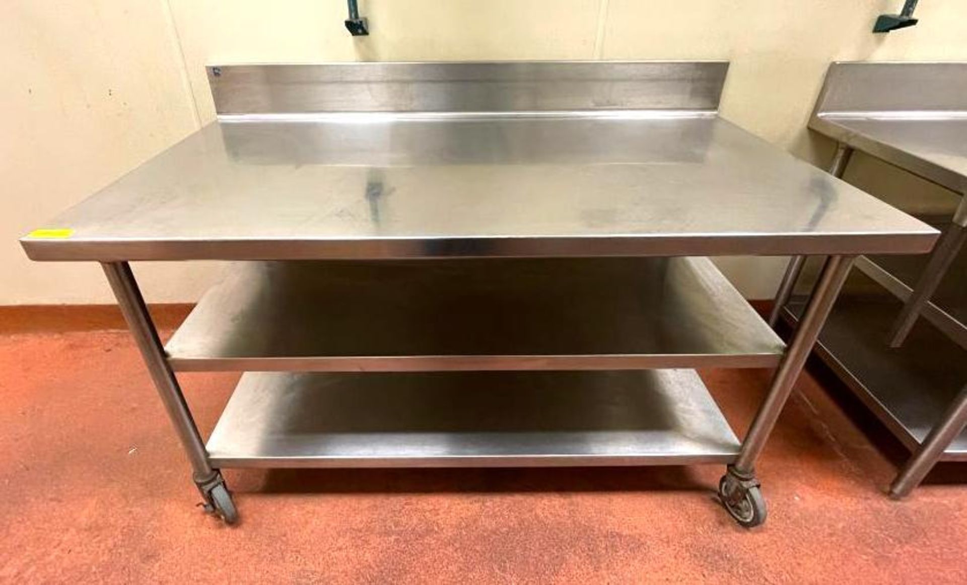DESCRIPTION 5' STAINLESS TABLE WITH BACKSPLASH AND UNDERSTORAGE ON CASTERS SIZE 60"X30" QUANTITY: X