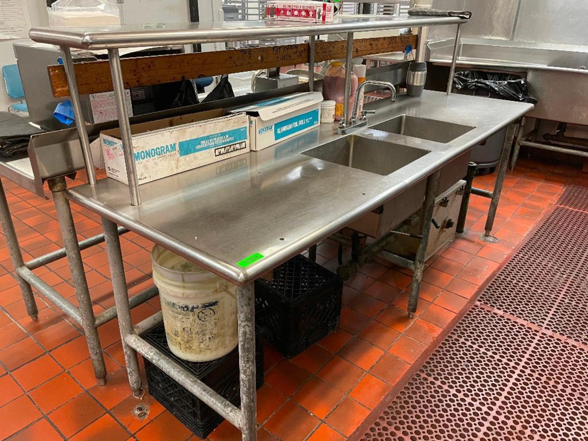 DESCRIPTION: 8' X 30" STAINLESS TABLE W/ TWO WELL SINK AND RISER SHELF SIZE: 8' X 30" LOCATION: KITC