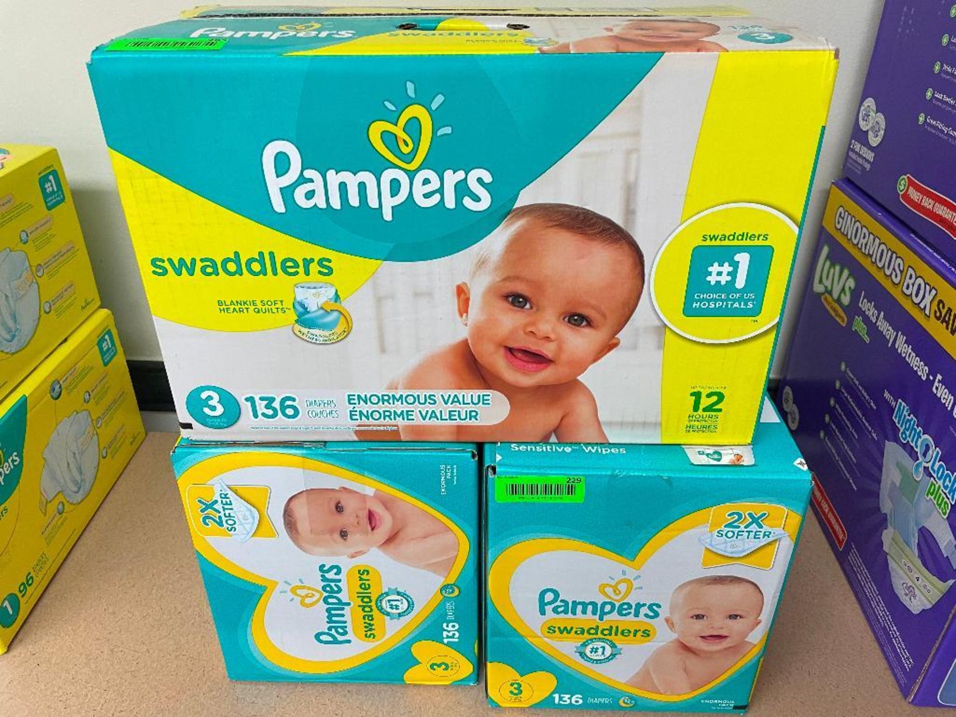 DESCRIPTION: (3) BOXES OF PAMPERS SWADDLERS SIZE 3 LOCATION: BASEMENT CONFERENCE ROOM QTY: 3