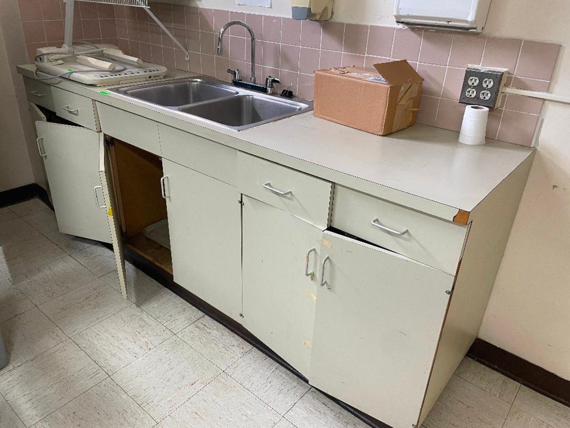 DESCRIPTION: 9' SIX DOOR COMPOSITE CABINET AND COUNTER W/ DROP IN STAINLESS SINK. LOCATION: BASEMENT