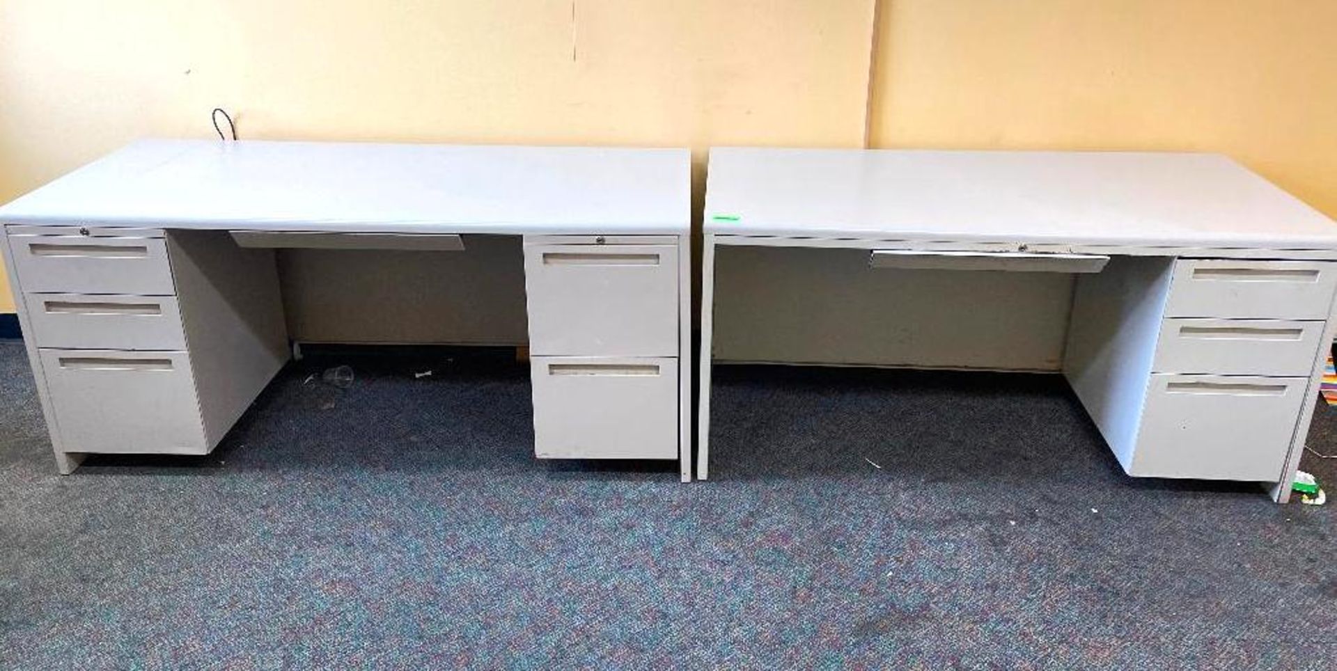 DESCRIPTION (2) 60" X 30" METAL FRAMED OFFICE DESKS LOCATION 540 THIS LOT IS ON MONEY QUANTITY 1