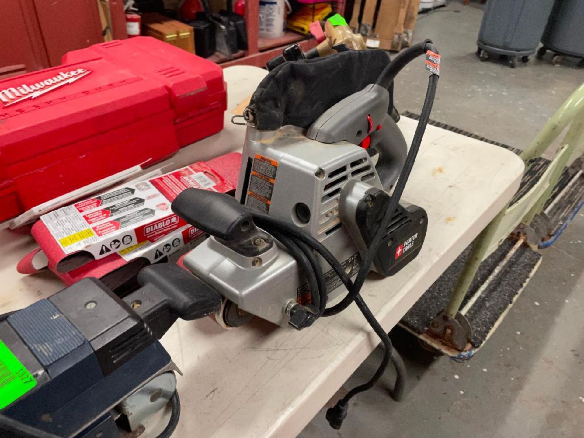 DESCRIPTION: ELECTRIC SANDER PAIR WITH ADDITIONAL BELTS THIS LOT IS: ONE MONEY QTY: 1 - Image 7 of 9