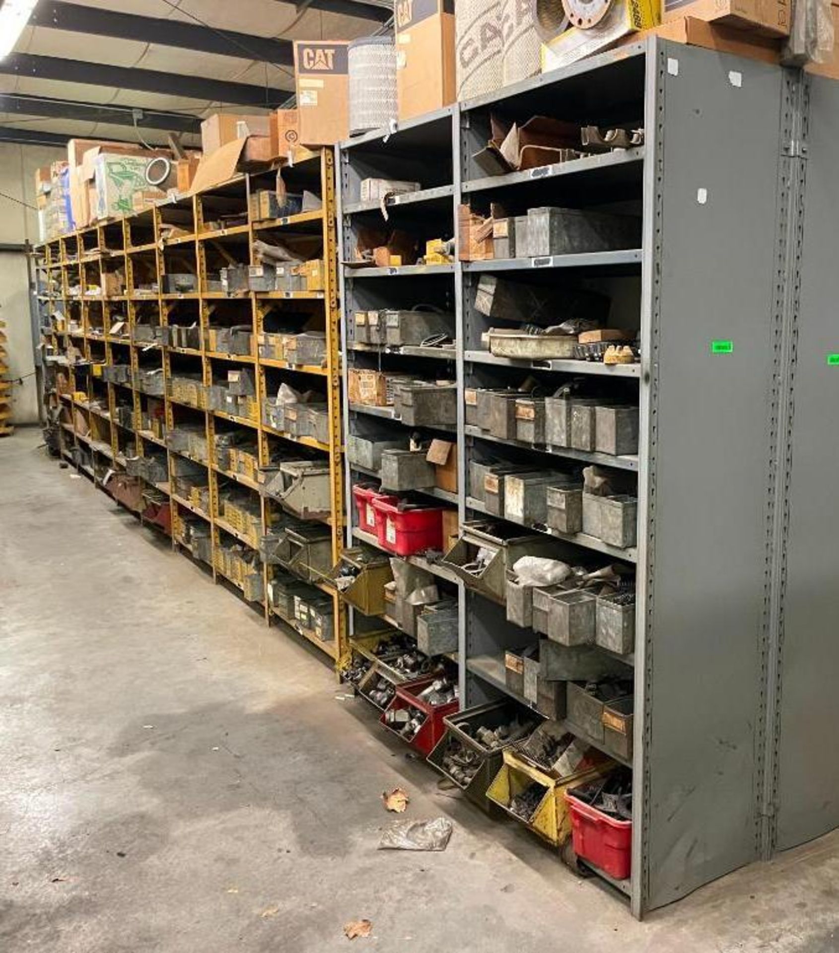 SHELVING UNITS WITH LARGE AMOUNT OF AUTOMOTIVE AND HEAVY MACHINERY PARTS AS SHOWN ADDITIONAL INFO SE