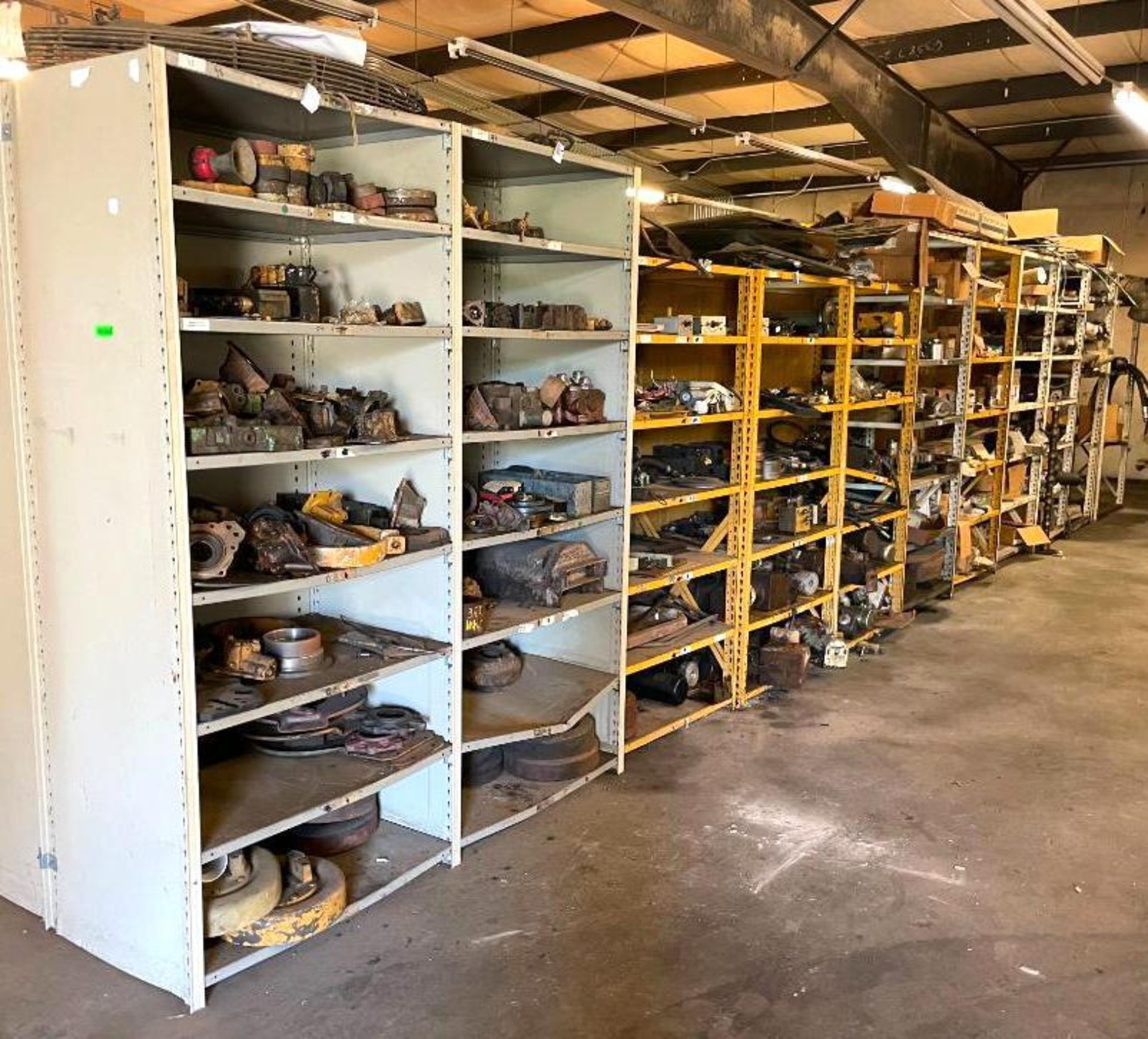 SHELVING UNITS WITH LARGE AMOUNT OF AUTOMOTIVE AND HEAVY MACHINERY PARTS AS SHOWN ADDITIONAL INFO SE