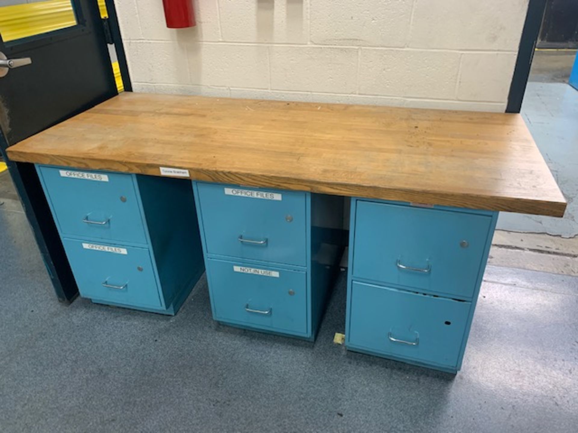 30" x 72" x 1-3/4" Oak Table Top sitting on 3 Workplace 2 Drawer Cabinets