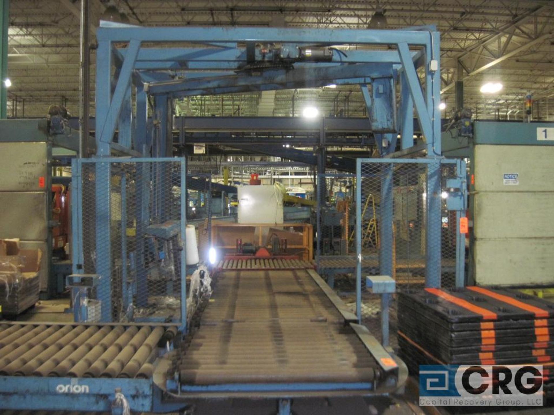 Orion MA44 automatic rotary pallet stretch wrapper with auto index in and out feed conveyor Sn: