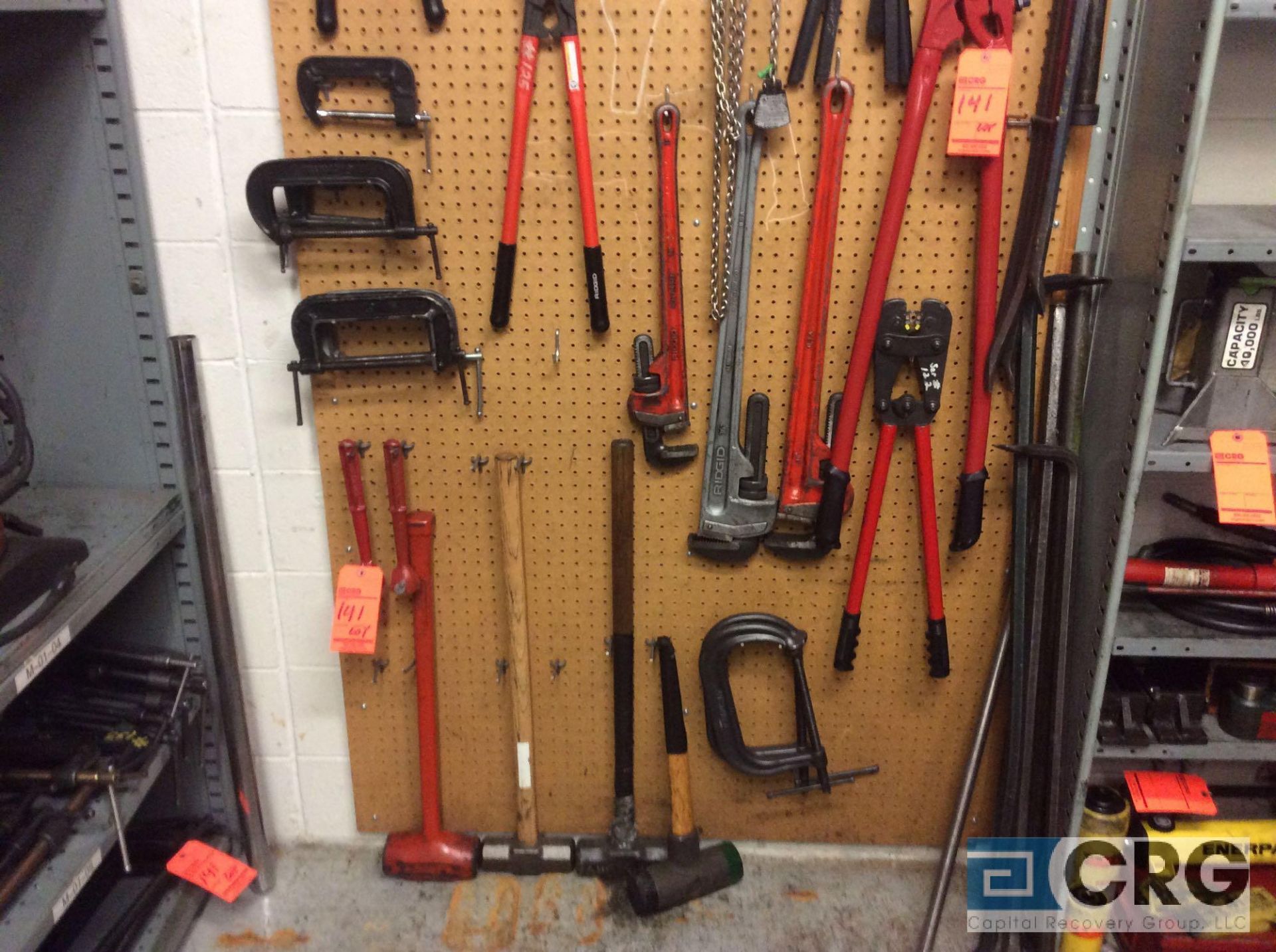 lot of assorted hand tools and C clamps etc. includes pipe wrenches, sledge hammers, pry bars,