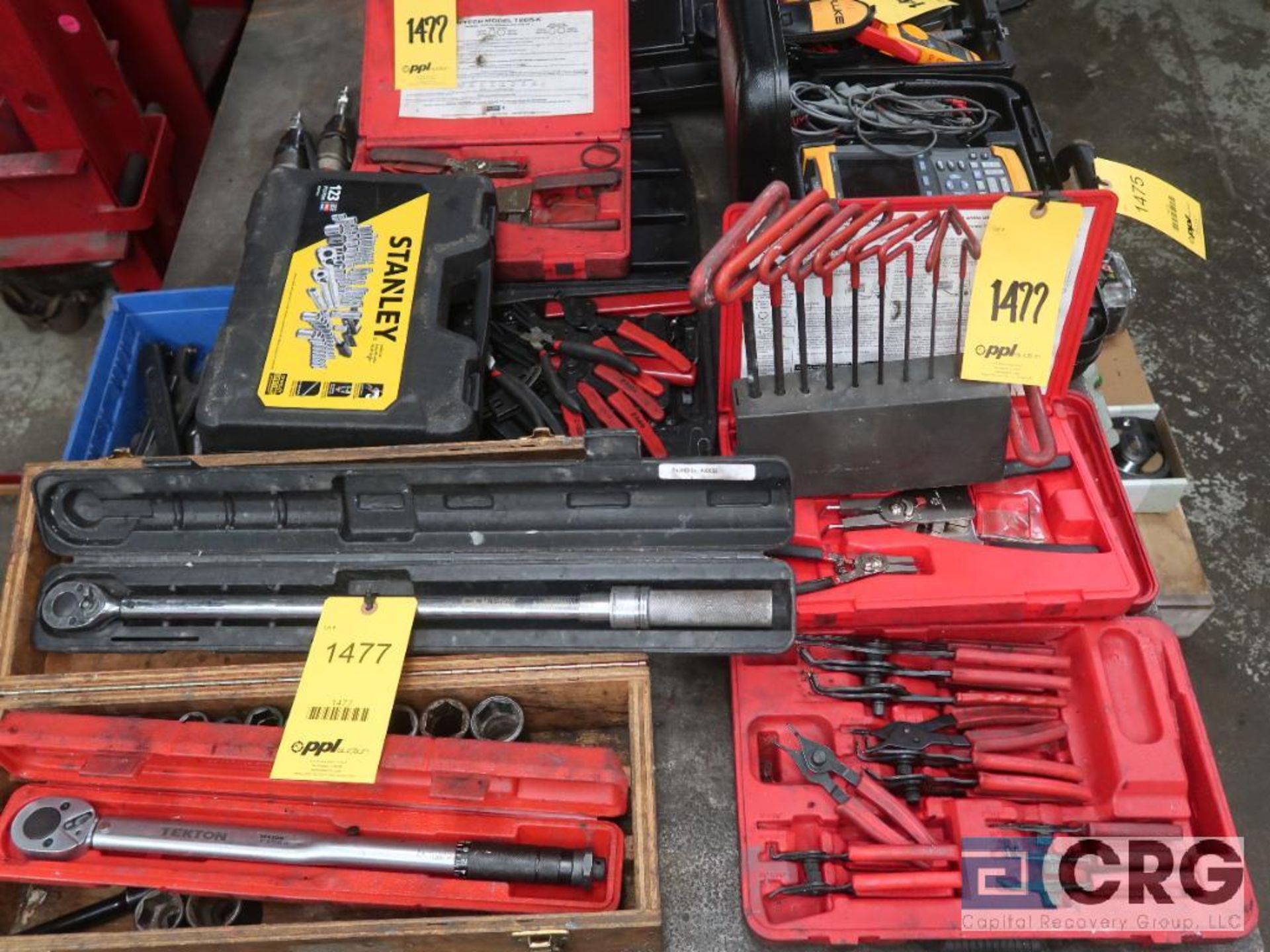 Lot of assorted hand tooling including ring pliers, socket set, torque wrenches, t-bar, and allen