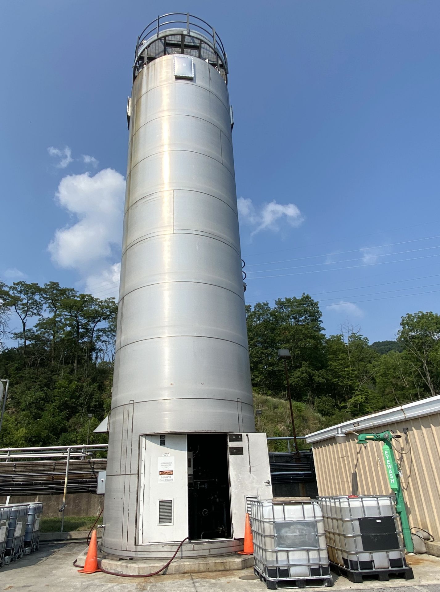 Activated carbon tank, stainless tank inside stainless shell, cone bottom, approximately 35’